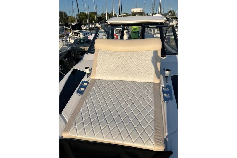 Slide: The Image of 2014 Regal 35 Sport Coupe with anchor rode marking chart by the water. - 24