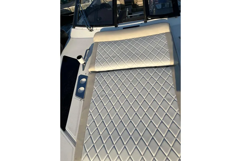 Slide: The Image of 2014 Regal 35 Sport Coupe with luxurious sunbed and cup holders, docked at marina. - 25