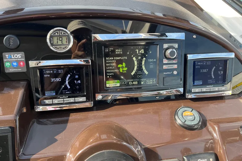 Slide: The Image of Garmin radar on 2014 Regal 35 Sport Coupe, marina background, cloudy sky. - 33