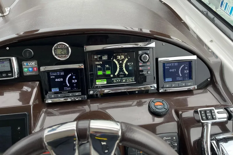 Slide: The Image of Dashboard of a 2014 Regal 35 Sport Coupe with digital displays and controls. - 34
