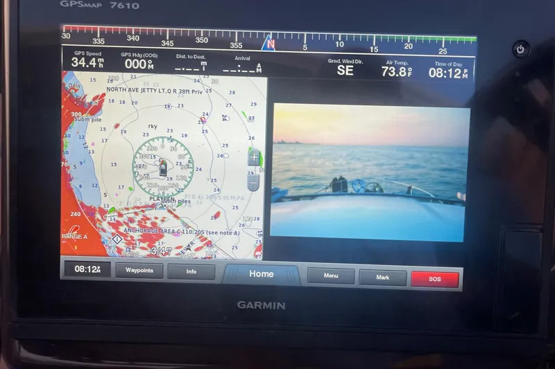 Slide: The Image of Display screen showing marina view from 2014 Regal 35 Sport Coupe. - 38