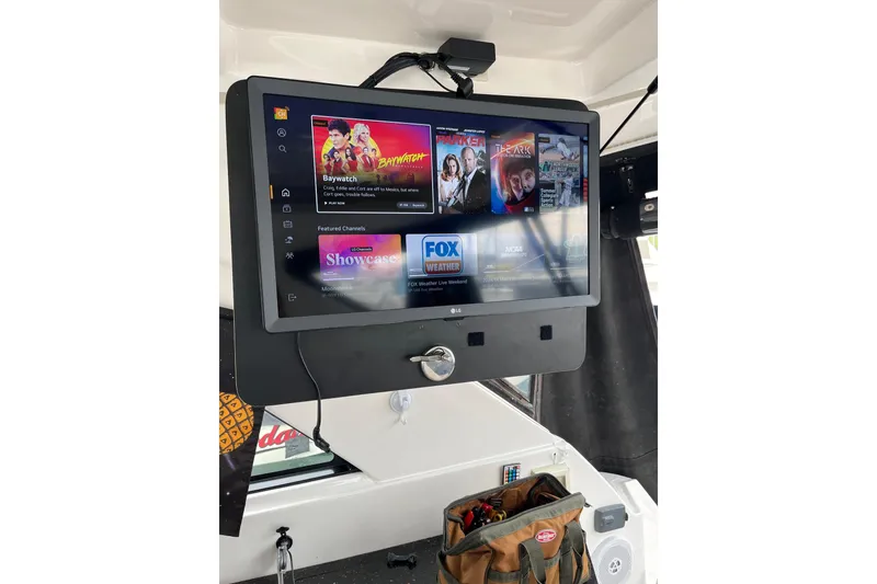 Slide: The Image of Volvo Penta joystick control on 2014 Regal 35 Sport Coupe boat dashboard. - 42