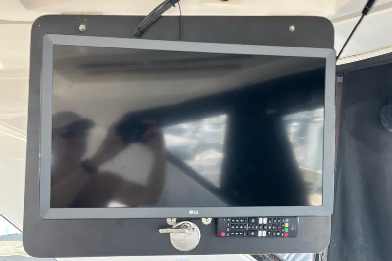 Slide: The Image of Interior of 2014 Regal 35 Sport Coupe showing steering wheel and control panel. - 44