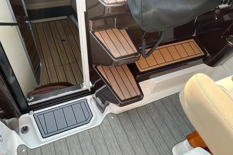 Slide: The Image of LG TV with remote on a 2014 Regal 35 Sport Coupe boat. - 48