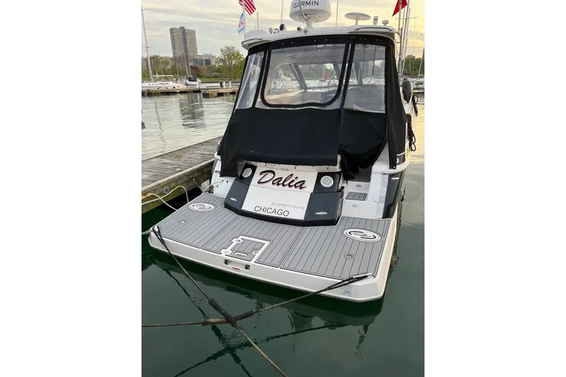 Slide: The Image of 2014 Regal 35 Sport Coupe yacht docked in a marina, Chicago. - 5