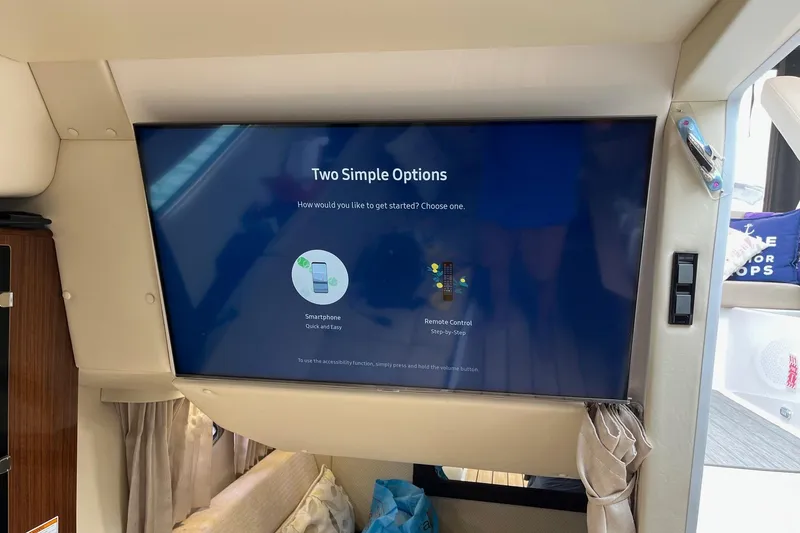 Slide: The Image of 2014 Regal 35 Sport Coupe cabin entrance with sleek wooden deck design. - 53