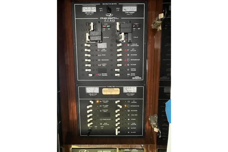 Slide: The Image of Cup holder and socket on 2014 Regal 35 Sport Coupe boat interior. - 54