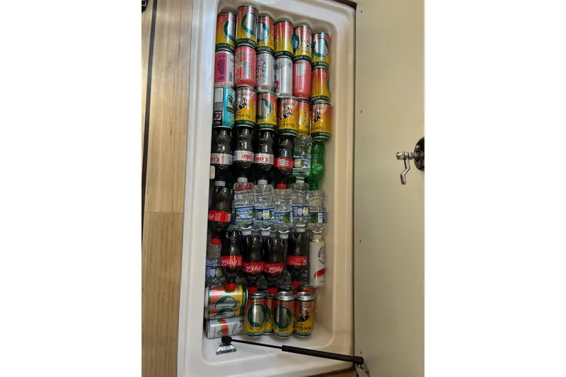 Slide: The Image of 2014 Regal 35 Sport Coupe boat interior detail with sleek flooring design. - 56