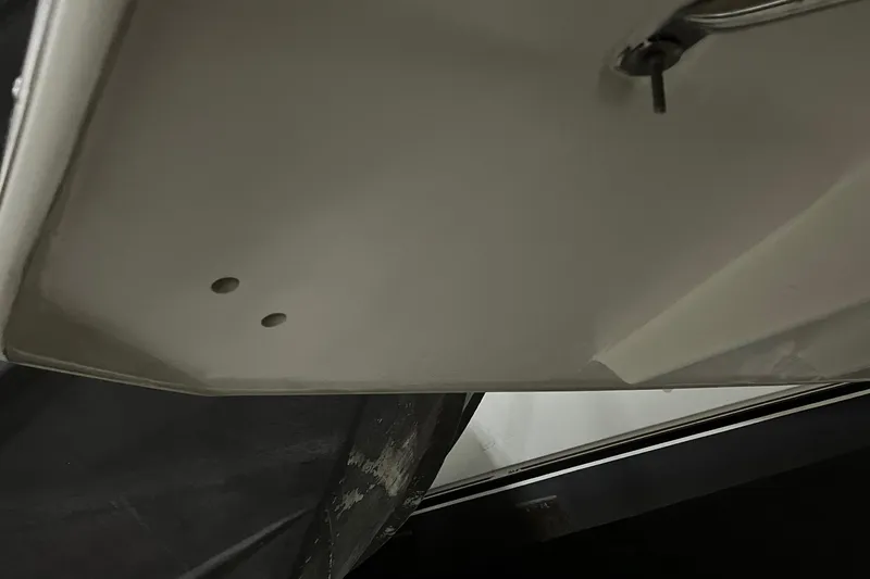 Slide: The Image of Interior cabin of 2014 Regal 35 Sport Coupe with beige seating and cushions. - 59