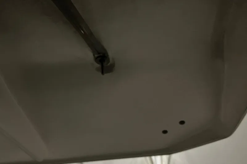 Slide: The Image of 2014 Regal 35 Sport Coupe boat reflecting on calm water surface. - 65