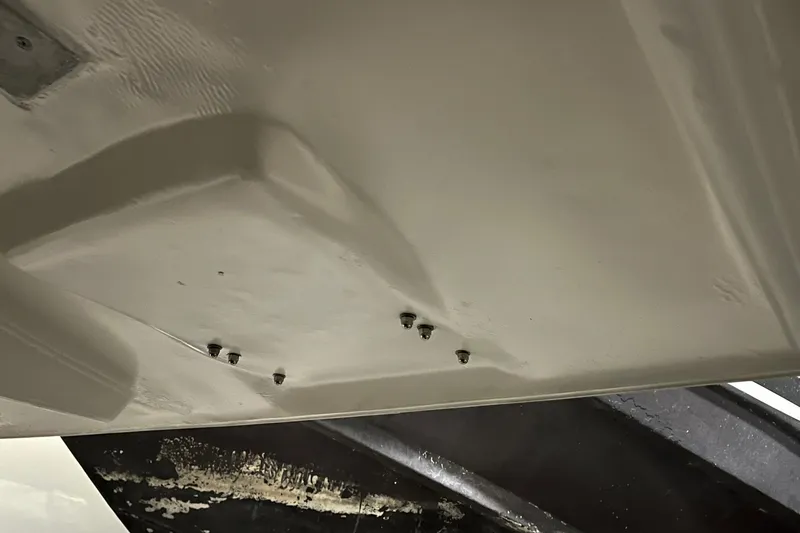 Slide: The Image of 2014 Regal 35 Sport Coupe boat hull detail with visible fittings. - 66