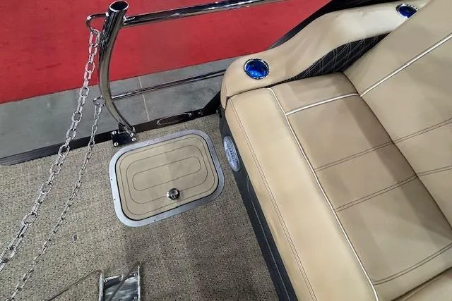 Slide: The Image of Luxurious seating on 2026 Barletta Lusso 25UC boat with beige upholstery and cup holders. - 17
