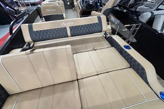 Slide: The Image of Luxurious interior of 2026 Barletta Lusso 25UC pontoon boat with beige seating. - 19