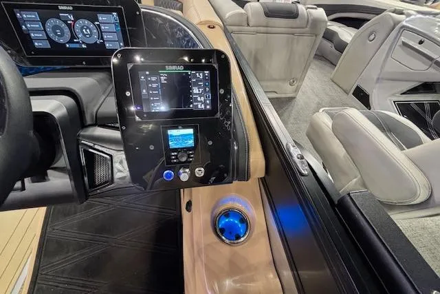 Slide: The Image of 2026 Barletta Lusso 25UC boat interior with advanced control panel and luxurious seating. - 22