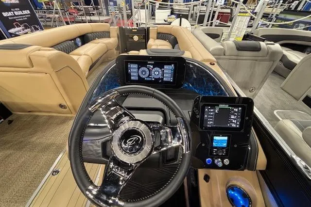 Slide: The Image of 2026 Barletta Lusso 25UC boat interior with modern steering and digital displays. - 23