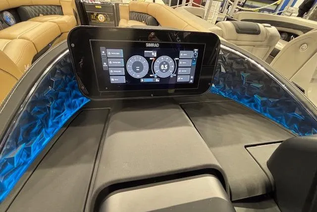 Slide: The Image of 2026 Barletta Lusso 25UC dashboard with Simrad display and luxurious seating. - 24