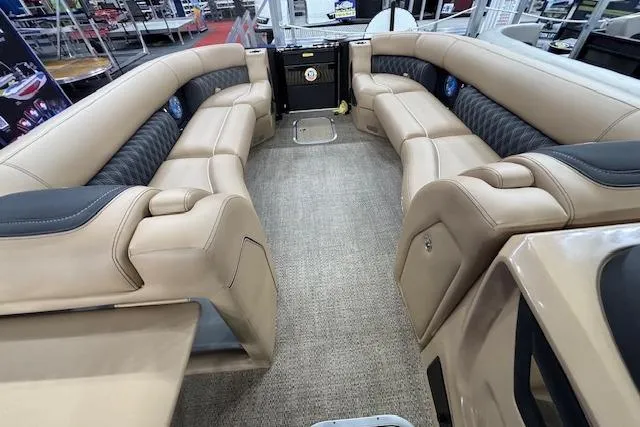 Slide: The Image of 2026 Barletta Lusso 25UC pontoon boat interior with luxurious seating and carpeted flooring. - 29