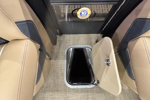 Slide: The Image of Hatch door on 2026 Barletta Lusso 25UC boat interior, showcasing storage access. - 33