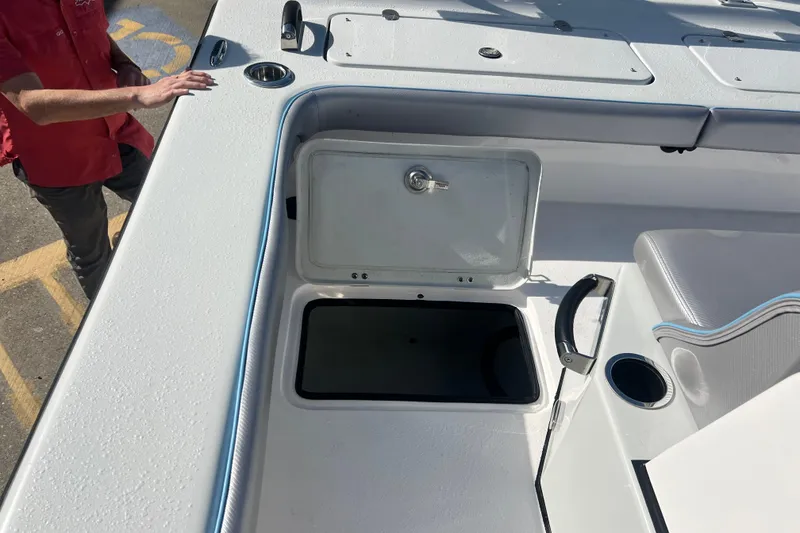 Slide: The Image of 2026 Shallow Stalker The Boss boat interior with storage compartment and seating. - 13