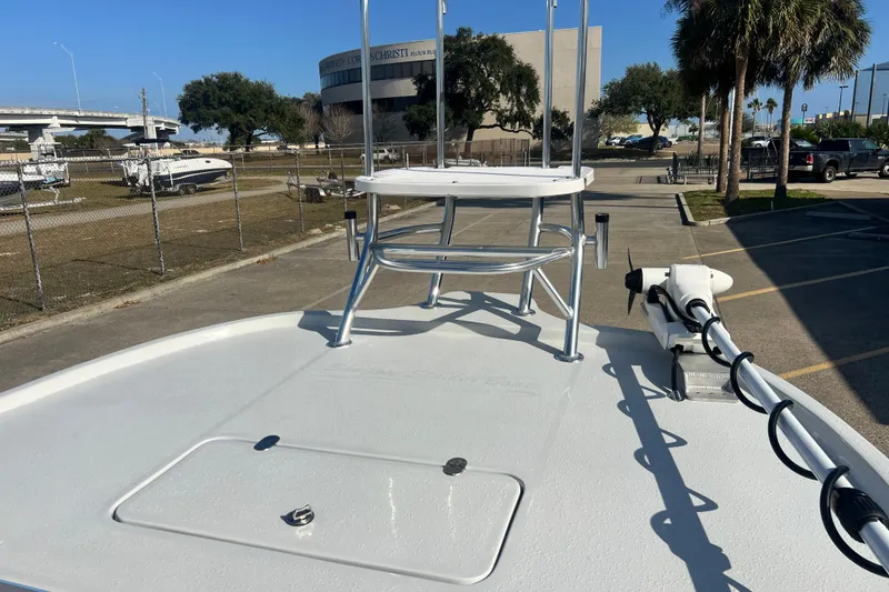 Slide: The Image of Shallow Stalker The Boss 2026 boat deck with tower and trolling motor in parking lot. - 15