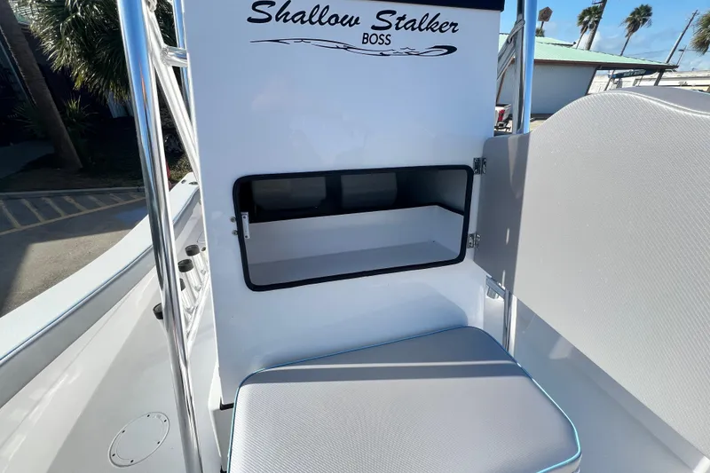 Slide: The Image of 2026 Shallow Stalker The Boss boat interior with open storage compartment. - 20
