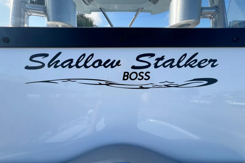 Slide: The Image of Shallow Stalker The Boss 2026 boat logo on white surface. - 21
