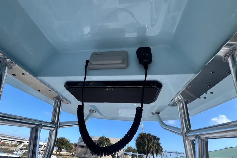 Slide: The Image of 2026 Shallow Stalker The Boss boat console with Garmin equipment and clear blue sky. - 22