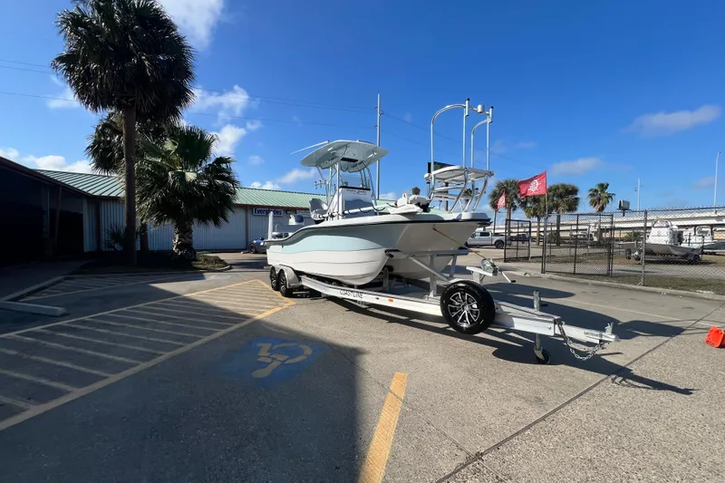 Slide: The Image of 2026 Shallow Stalker "The Boss" boat on trailer in sunny parking lot. - 3