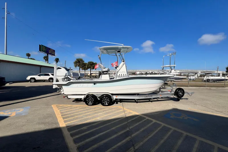 Slide: The Image of 2026 Shallow Stalker "The Boss" boat on trailer in sunny parking lot. - 4