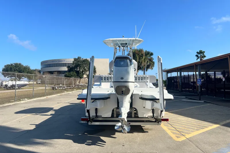 Slide: The Image of Shallow Stalker The Boss 2026 boat, rear view, parked near university campus. - 5