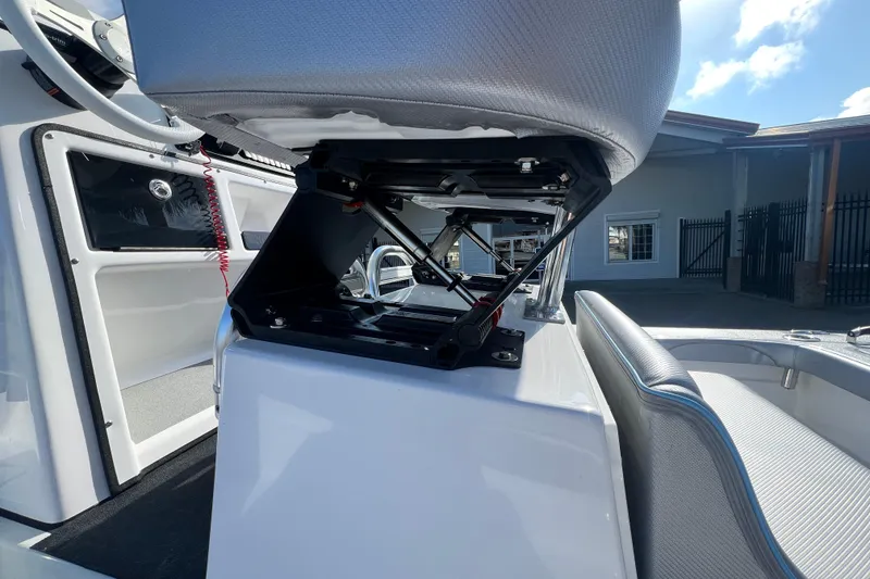 Slide: The Image of 2026 Shallow Stalker The Boss boat interior with adjustable seat mechanism. - 7