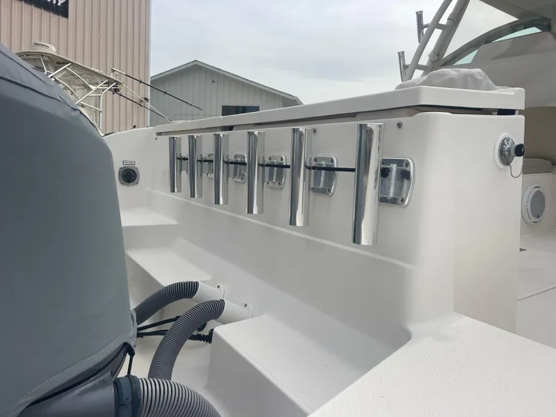 Slide: The Image of 2016 Pursuit DC 325 Dual Console with fishing rod holders. - 12