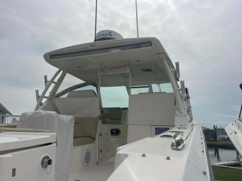 Slide: The Image of Pursuit DC 325 Dual Console boat, 2016 model, docked. - 13