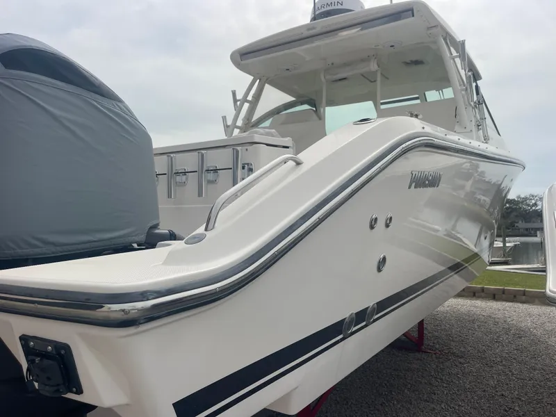 Slide: The Image of 2016 Pursuit DC 325 Dual Console boat at dock. - 14