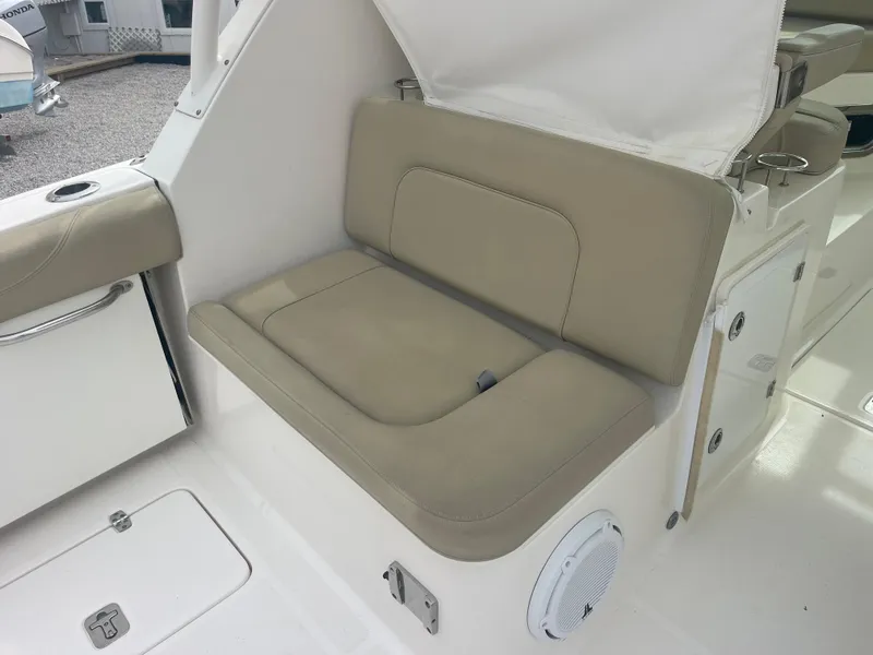 Slide: The Image of Seating area on a 2016 Pursuit DC 325 Dual Console boat. - 18