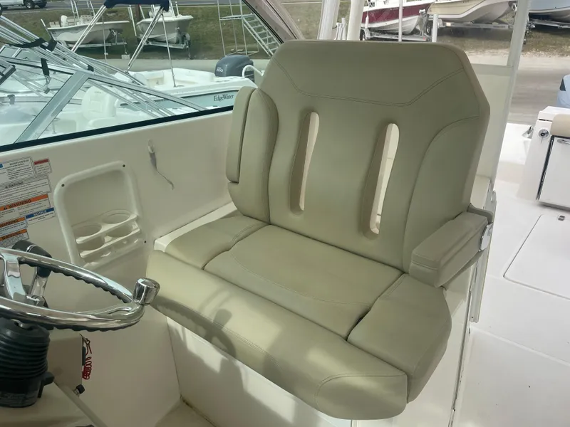 Slide: The Image of Helm seat of 2016 Pursuit DC 325 Dual Console boat. - 22