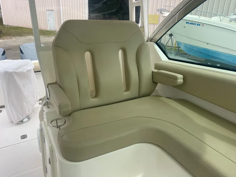 Slide: The Image of Beige seat in 2016 Pursuit DC 325 Dual Console boat. - 23