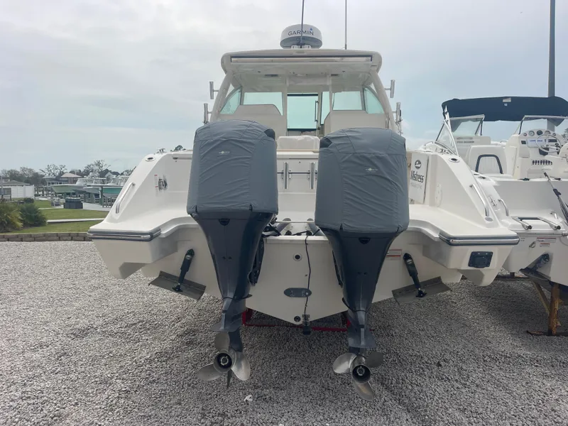 Slide: The Image of 2016 Pursuit DC 325 Dual Console boat with twin engines. - 8