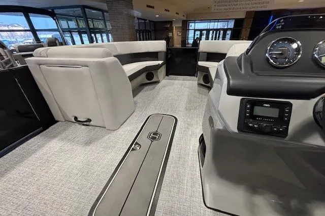 Slide: The Image of 2026 Harris Cruiser 230 interior with plush seating and modern dashboard. - 28