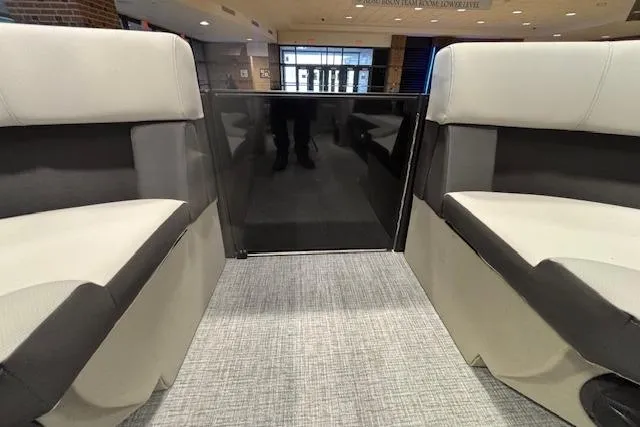 Slide: The Image of Interior of 2026 Harris Cruiser 230 boat with modern seating design. - 36