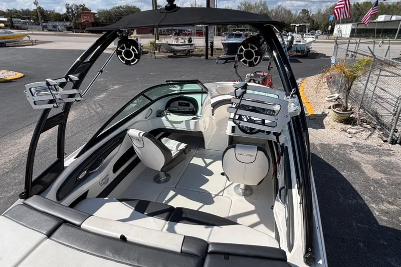Slide: The Image of 2014 Sea Ray 205 Sport boat interior with seating and wakeboard tower. - 15