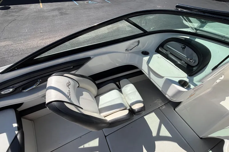 Slide: The Image of 2014 Sea Ray 205 Sport boat interior with seating and dashboard view. - 18