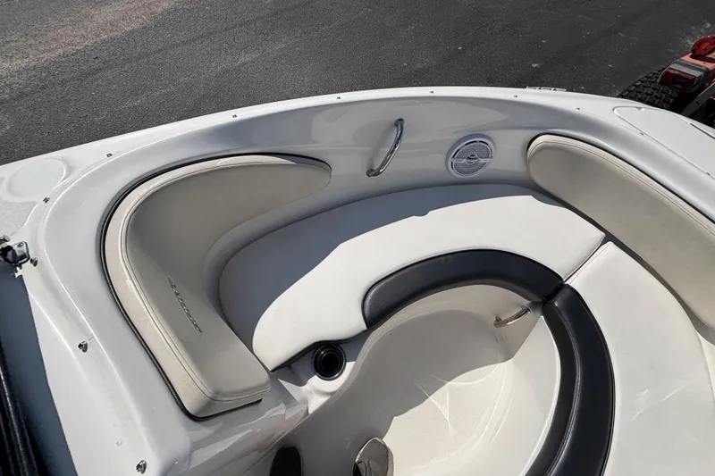 Slide: The Image of 2014 Sea Ray 205 Sport boat interior with white and black seating. - 25