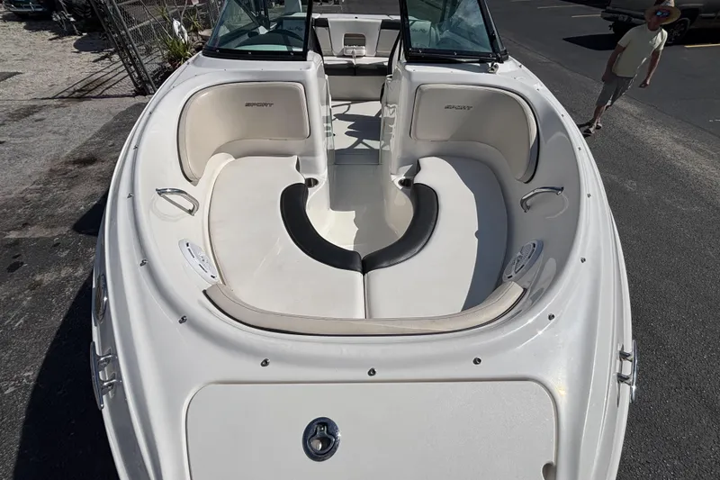 Slide: The Image of 2014 Sea Ray 205 Sport boat with spacious seating and sleek design. - 9