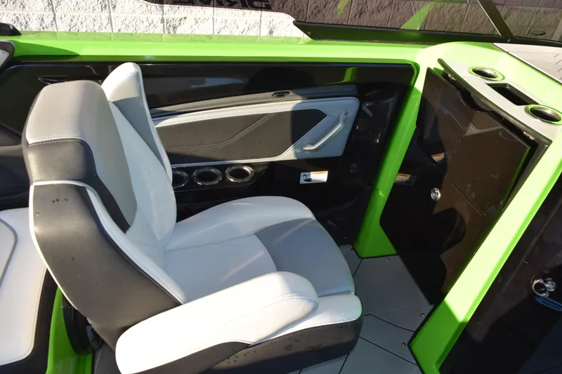 Slide: The Image of 2022 Yamaha Boats 255XD interior with green accents and comfortable seating. - 20