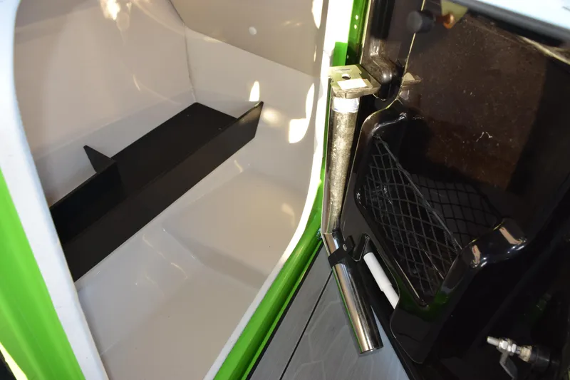 Slide: The Image of Interior storage compartment of 2022 Yamaha Boats 255XD, featuring sleek design and practical space. - 24