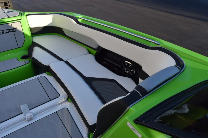 Slide: The Image of 2022 Yamaha Boats 255XD interior with green and white seating, modern design. - 27