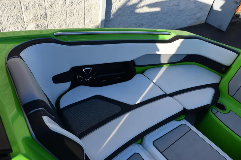Slide: The Image of 2022 Yamaha Boats 255XD interior with green and white seating, modern design. - 28