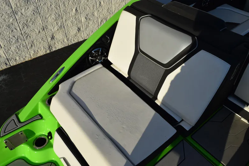 Slide: The Image of 2022 Yamaha Boats 255XD interior with green accents and cushioned seating. - 7