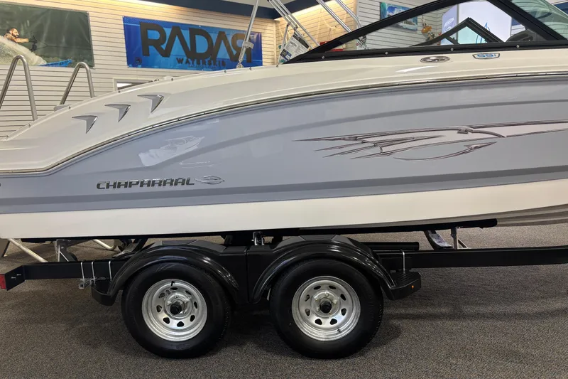Slide: The Image of 2026 Chaparral 21 SSi Ski & Fish boat on trailer in showroom. - 10